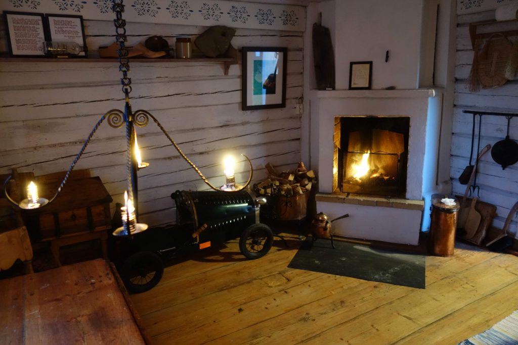 An image of a mideval church cottage with a fireplace